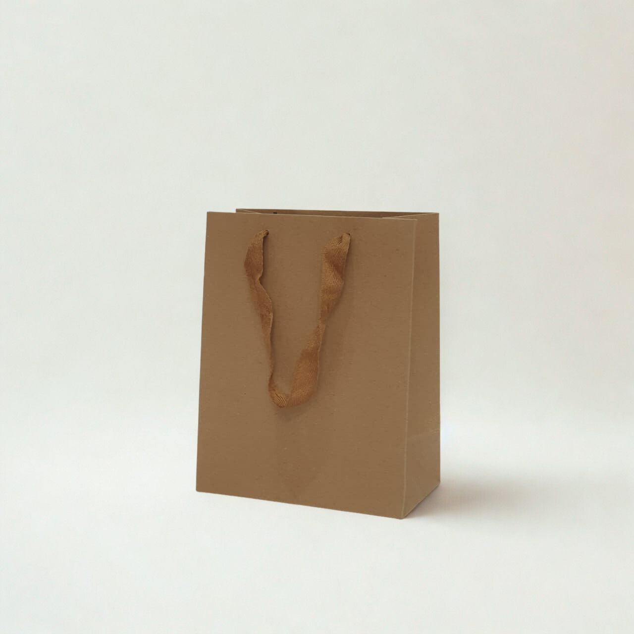 A5 size brown kraft paper gift bag with ribbon handles for small gifts