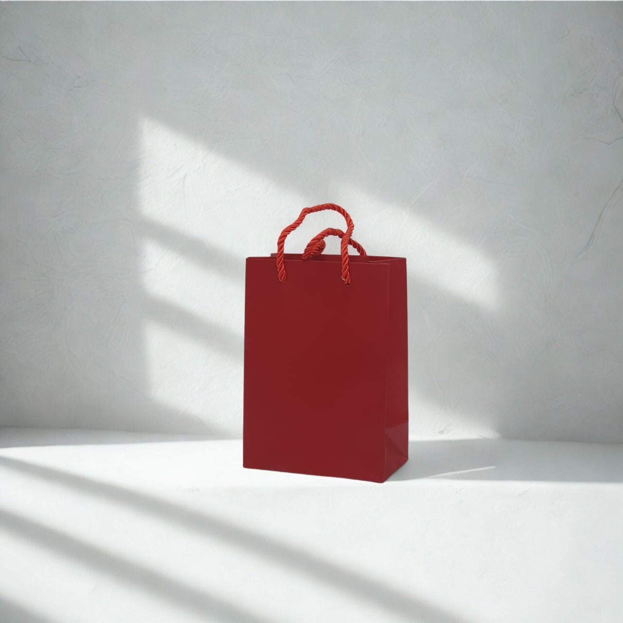 A5 size red paper gift bag with handles for small retail items