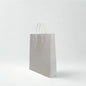 Medium white kraft paper bag with twisted paper handles for retail and gifts
